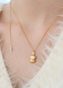 Perfume bottle necklace / emiru logo