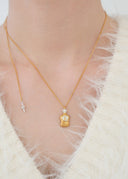 Perfume bottle necklace / emiru logo