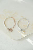 emiru x momota / Heart ribbon bracelet ( pearl )